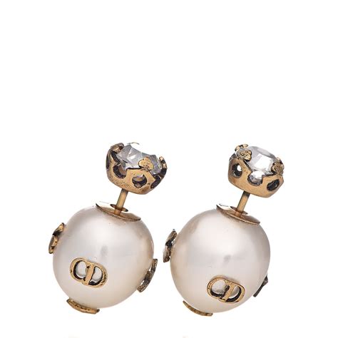 dior tribal bracelet|Dior pearl earrings.